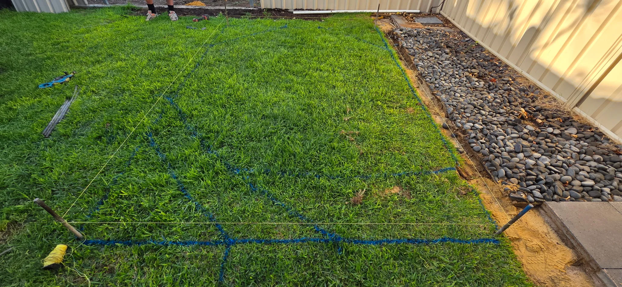 String lines marking out pool and concrete pad position on lawn before excavation at Manningham