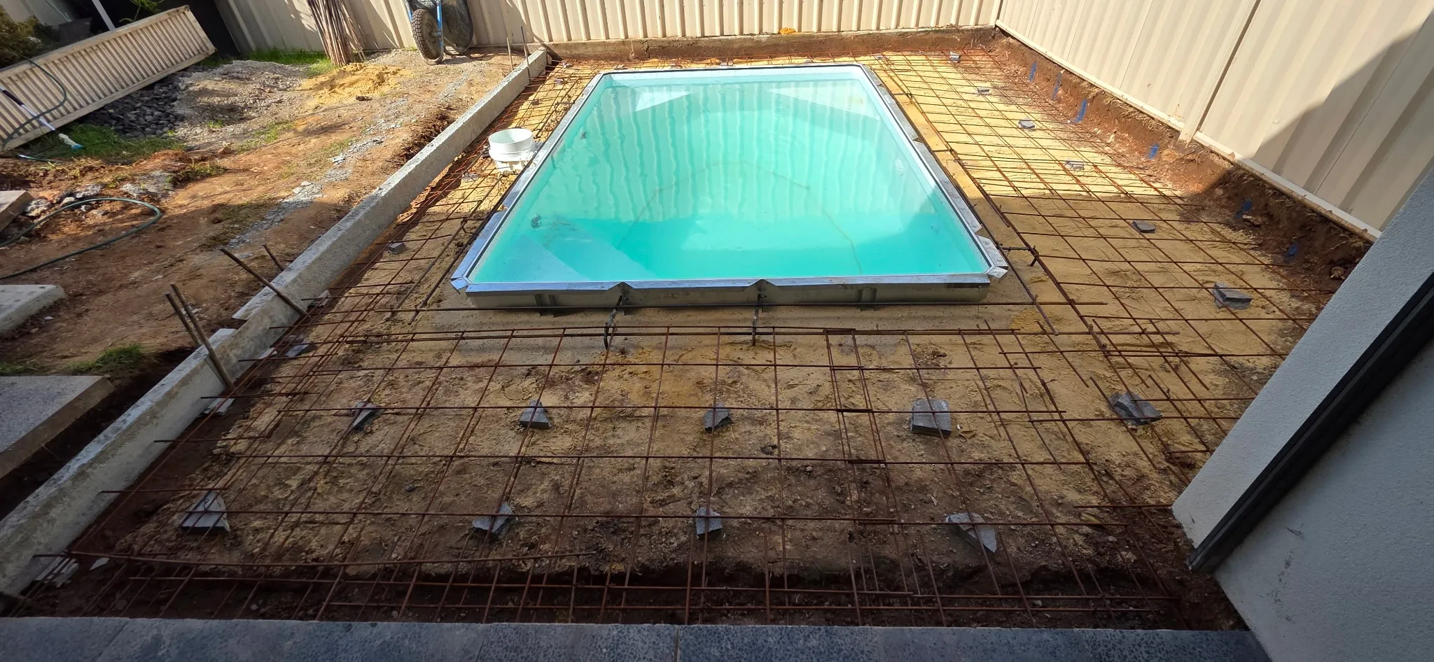 Alternate angle of reinforcing mesh and spigot preparations around hybrid plunge pool at Manningham