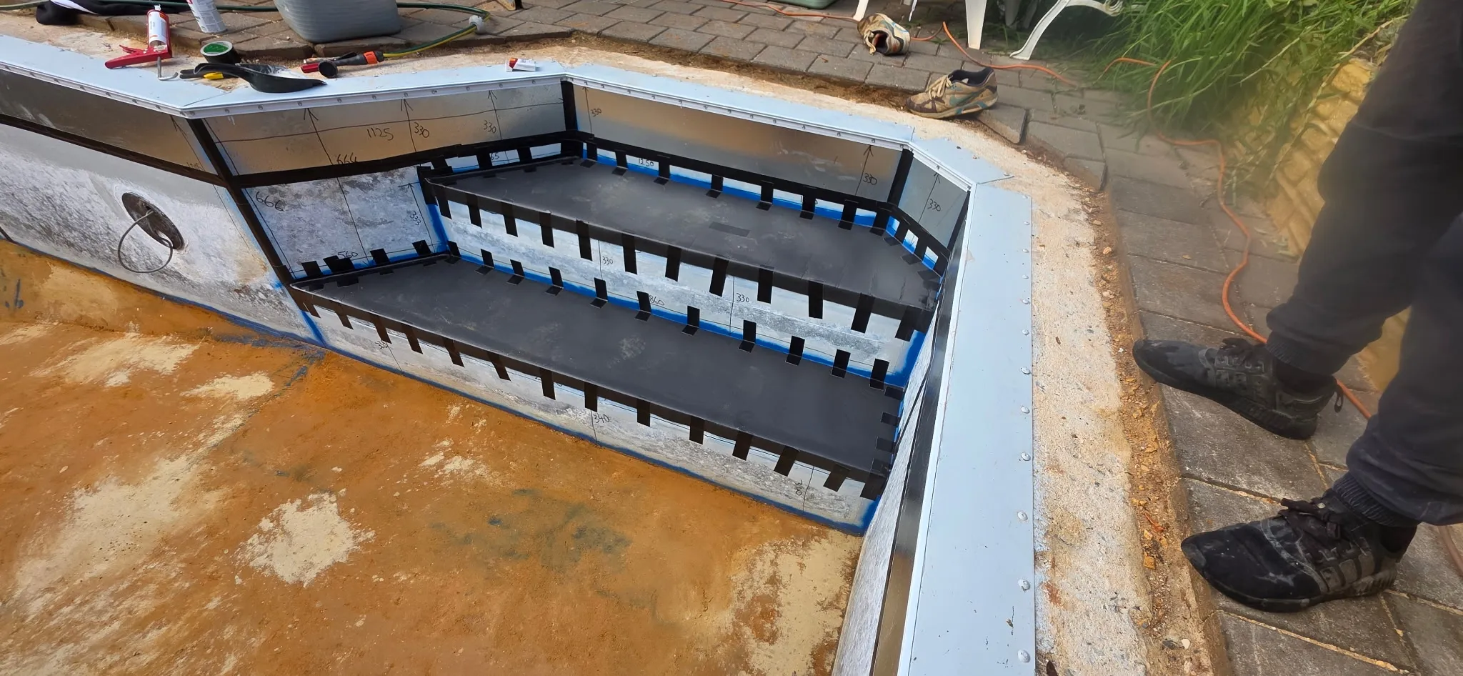 High density foam fitted to step entry for luxury soft feel before liner installation at Andrews Farm