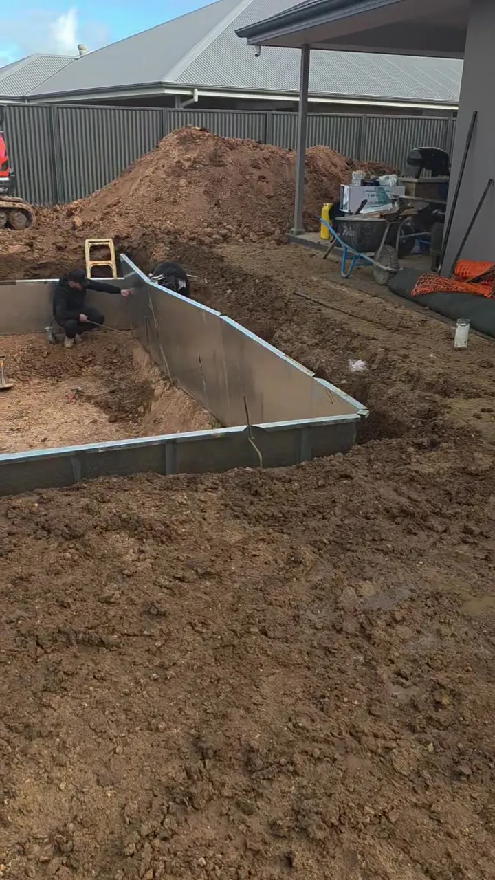 Steel frame pool walls standing in the excavation at Roseworthy