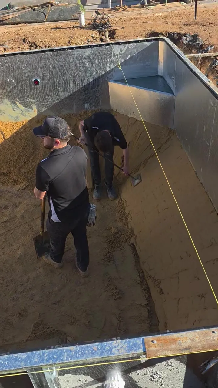 Sand base being spread across the pool floor at Roseworthy