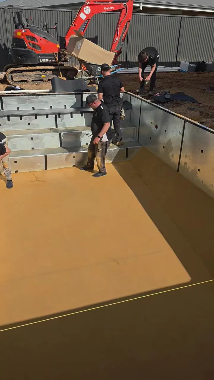 Pool floor base being screeded level at Roseworthy