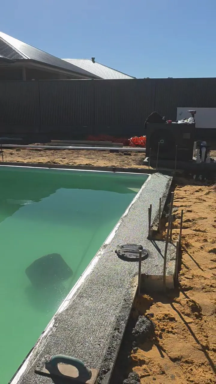 Concrete bond beam being poured around the pool at Roseworthy