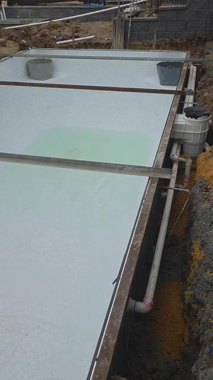 Aqualux Lindeman liner installed at Woodcroft with water filling and the corner step entry and swimouts visible